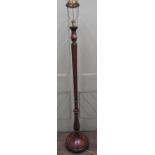 A late Edwardian lamp standard of full height inverted tapered and fluted column and disc base