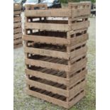 A stack of eight vintage wooden rectangular potato trays with printed lettering R. Chester, 76 cm