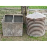 A vintage galvanised steel grain bin of squat cylindrical and ribbed form beneath a domed cap 75