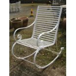 A heavy gauge sprung steel framed garden rocking chair with strapwork seat and combined back with