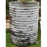 A vintage galvanised steel ribbed cylindrical water butt complete with tap, 67 cm diameter x 90 cm