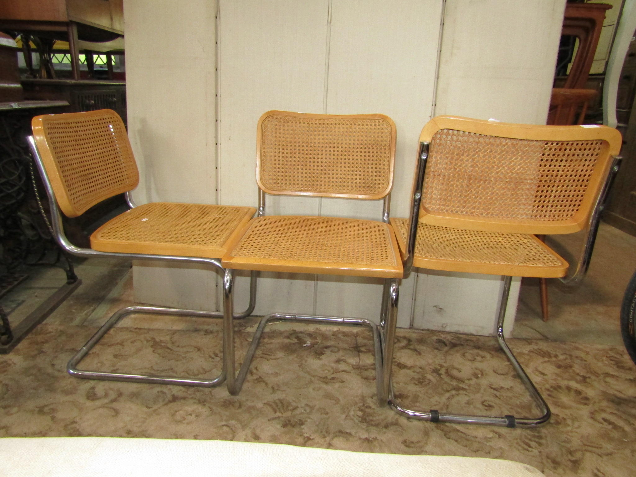A set of three tubular framed cantilever dining chairs with cane panelled seats and backs - Image 2 of 2