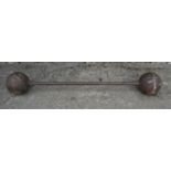 An original vintage cast iron Strong Man Bar Bell, 145cm long