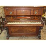 An upright iron framed overstrung piano by H Gutschow of Berlin in a figured walnut case with