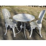 Weathered cream painted cast aluminium three piece garden terrace set, comprising circular top table