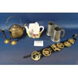 A miscellaneous collection of items, including two pewter tankards, horse brasses, a pair of brass