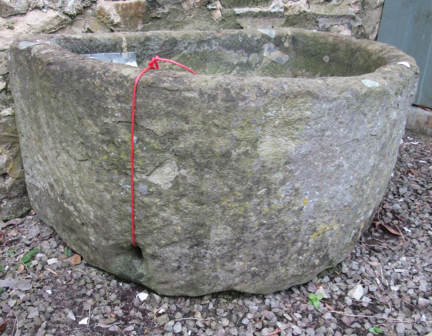 A weathered natural stone D shaped trough (broken and repaired but complete) 94cm wide - Image 3 of 5