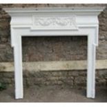 19th century fire surround with ribbon and garland panel a moulded frame, 142cm wide x 134cm high