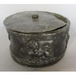 A 19th century lead tobacco jar with cover, with lions applied to the side.