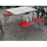 A vintage aluminium framed folding portable suitcase picnic table labelled Selwart Engineering
