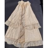 Late 19th/early 20th century baby carrying cape in cream wool, partially lined in silk, with