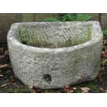 A weathered natural stone deep D shaped trough 55 cm wide x 45 cm deep x 25 cm high