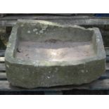 A shallow but thick bottomed weathered natural stone D shaped trough (AF), 81 cm wide x 67 cm deep x