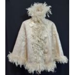 A late 19th/ early 20th century shoulder cape in ivory watermarked moire fabric (possibly silk)