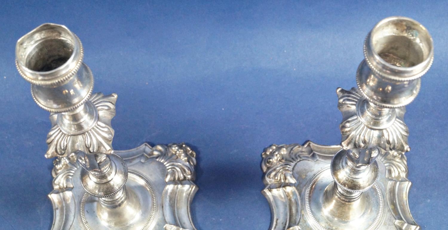 A pair of Georgian silver candlesticks with detachable sconces, raised on engraved stepped bases, - Image 6 of 6