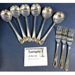 A large quantity of silver plated flatware mostly wrapped in cloth bags. (A collection)