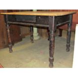A pine kitchen table with scrub top on four turned supports, 105 cm wide