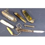 Good quality stainless steel pocket knife with multi gadget action and six other smaller examples (
