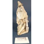 Lladro figure of an elderly gentleman sitting with dog at his side, height 27cm