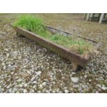 A small vintage cast iron feeding trough of rectangular form raised on splayed supports, 90 cm