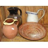 A collection of Studio pottery including ewers, dishes, etc