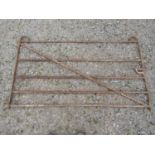 An old ironwork five bar gate with thumb latch, 187cm wide x 108cm high