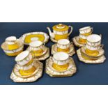 A collection of Salisbury Bradley china tea wares with yellow and gilt pattern comprising teapot and