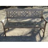 A pair of weathered contemporary hardwood three seat garden benches, with lattice panelled backs