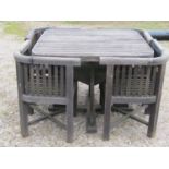 Weathered teak garden suite comprising table with square slatted top and rounded corners, raised