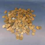 A quantity of unsorted bronze pennies and half pennies