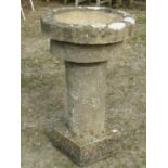 Weathered cast composition stone font type planter, the squat circular bowl with deep rim and