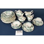 A collection of Booths Dragon Pattern china tea and dinner wares with green dragon pattern and
