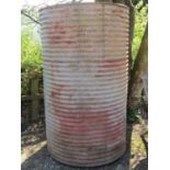 Large ribbed cylindrical galvanised steel water butt with pop rivetted seams and tap, 115cm diameter