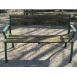 Two seat garden bench with weathered timber lathes, raised on a pair of green painted cast alloy end