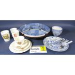 A collection of blue and white oriental soup or rice bowls with side plates serving spoons, etc