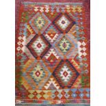 A Choi kilim with a multi coloured diamond pattern 123cm x 82cm and a small kilim mat similar 50cm