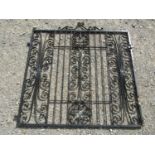 A pair of painted iron entrance gates with decorative open scroll detail, 272 cm wide x 137 cm