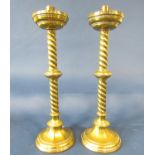 A pair of brass ecclesiastical barley twist candlesticks, 51cm tall.