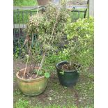 A contemporary glazed garden planter of circular slightly tapered form together with a weathered