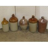 Collection of stoneware flagons of varying size and capacity, including a 19th century salt glazed