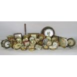 A circular granite framed barometer and a collection of little alarm clocks, 30 approx