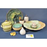 A large collection of studio pottery wares to include a large platter or wall hanging with green and
