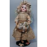 Small German bisque head doll by Simon & Halbig with pierced ears, brown closing eyes and open mouth