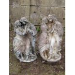 A matched pair of Romeo and Juliet weathered cast composition stone garden ornaments, 73 cm high