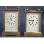 A simple brass carriage clock with eight day movement, retailed by Garrards and a further carriage