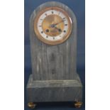 A 19th century French mantle clock in grey marble, the dial with engine turned detail in brass