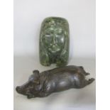 A bronzed finished recumbent pig 24cm wide, and a carved marble head of a woman. (2)