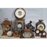 A miscellaneous collection of small clocks including a mantle clock in timber, a small chrome