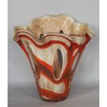 A Zorza glass handkerchief vase with oval openings in a swirled orange and brown design. 32cm high.