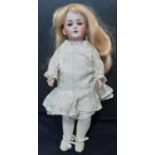 Small German bisque head doll by Simon & Halbig with jointed composition body, early 20th century.